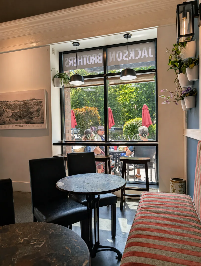 Window seating and the striped banquette inside Jackson Brothers Coffeehouse
